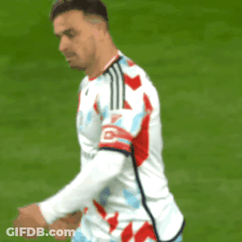 Soccer Player With Letter O On Red Blue Striped Jersey GIF
