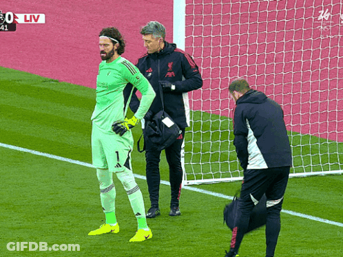Soccer Player With Man In Liverpool Jacket GIF