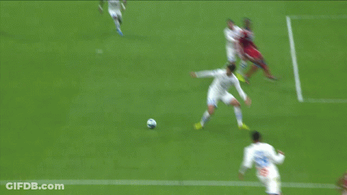Soccer Player With Number 15 Trying To Get Ball GIF