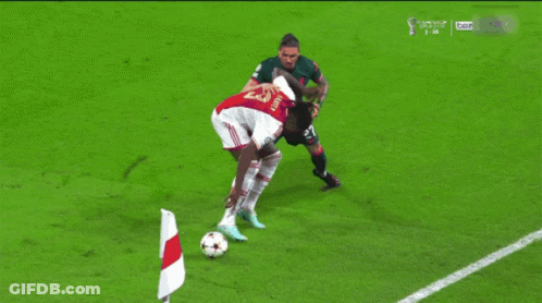 Soccer Player With Number 27 Kicks Ball GIF