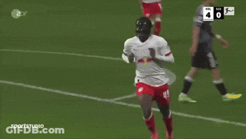 Soccer Player With Red Bull Jersey Hugged By Teammate GIF