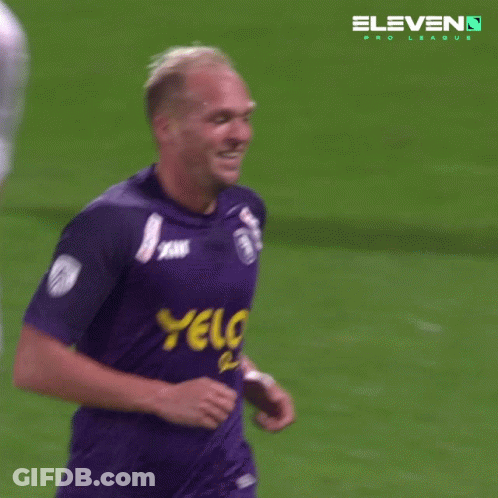 Soccer Player With Yellow Yelo On Purple Jersey GIF