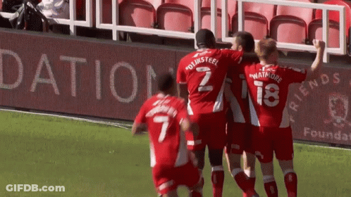 Soccer Players Celebrate Goal With Dation Sign GIF