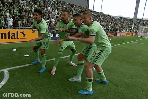Soccer Players Celebrating Goal With Continental Sign GIF