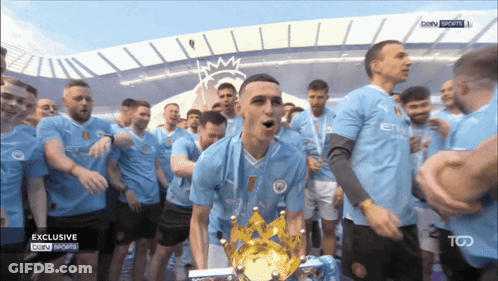 Soccer Players Celebrating With Exclusive Trophy GIF