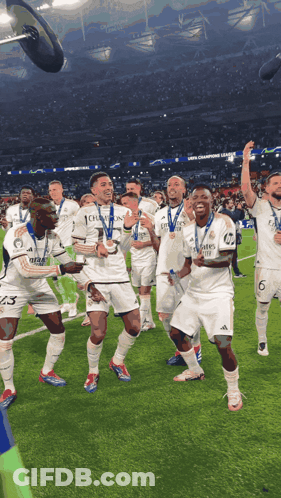 Soccer Players Celebrating With Medals GIF