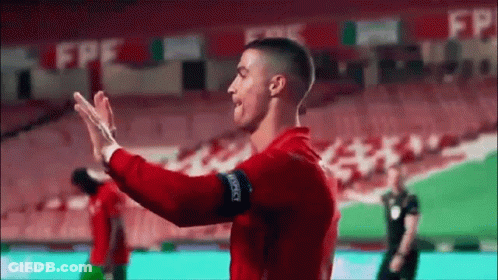 Soccer Players Giving High Five GIF