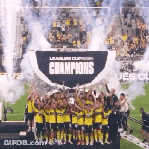 Soccer Players Holding Champions Trophy GIF