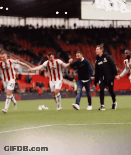 Soccer Players Holding Hands With Asics Hoodie GIF