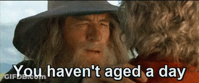 Soccer Players Holding Hands With Man In Asics Hoodie GIF