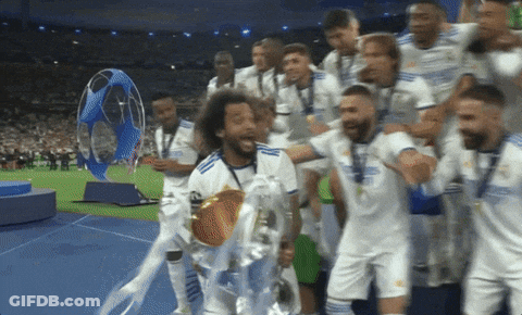 Soccer Players Holding Trophy GIF