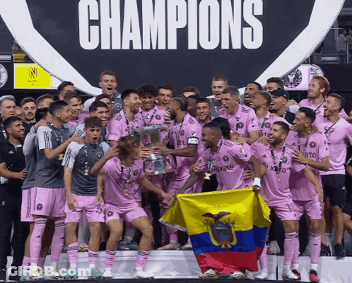 Soccer Players Holding Trophy And Flag In Front Of Champions Sign GIF