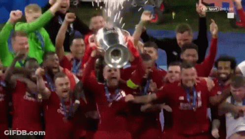 Soccer Players Holding Trophy GIF