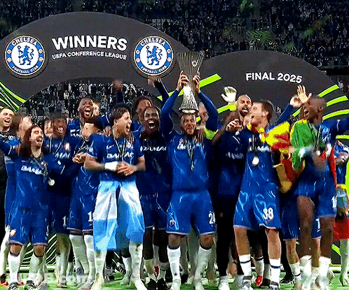 Soccer Players Holding Trophy In Front Of Winners Sign GIF