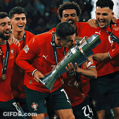Soccer Players Holding Trophy Number 24 On Shorts GIF