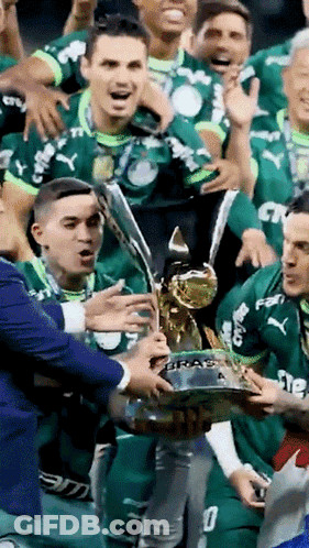 Soccer Players Holding Trophy Saying Braz GIF