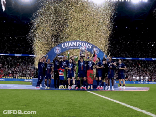 Soccer Players Holding Trophy Under Champions Arch GIF