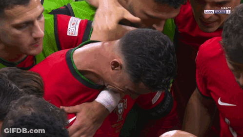 Soccer Players Huddle Around Bwin Sports Shirt GIF