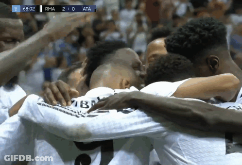 Soccer Players Huddle With Scoreboard RMA 2-0 ATA GIF