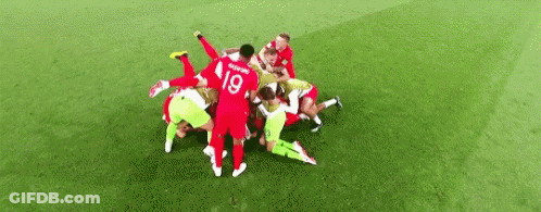 Soccer Players Huddled On Field GIF