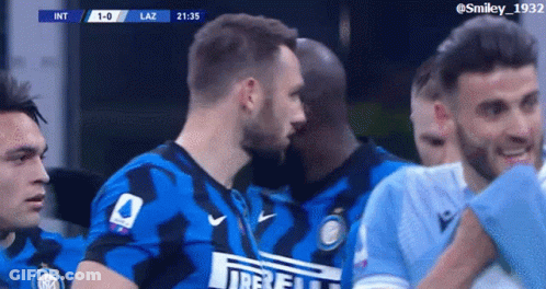 Soccer Players Huddled Wearing Irelli Shirt GIF