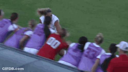 Soccer Players Huddled With Number 00 Red Jersey GIF