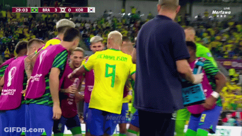 Soccer Players Huddled With Number 9 GIF