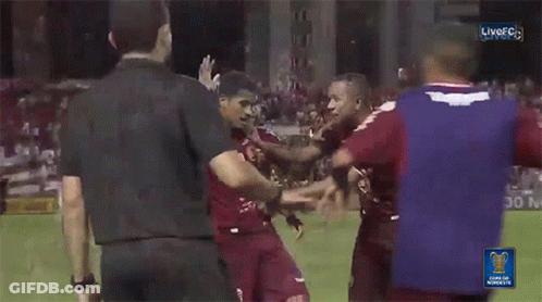 Soccer Players Huddled With Purple Shirt Saying Anaa GIF