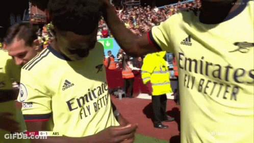 Soccer Players Hugging In Emirates Jerseys GIF