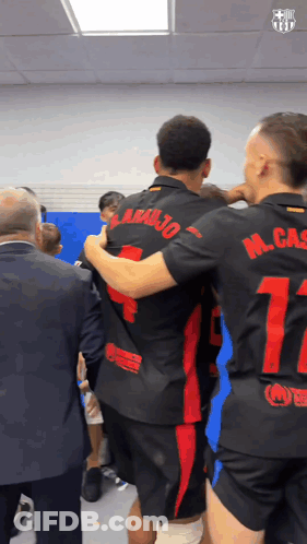 Soccer Players Hugging Number 17 On Back GIF