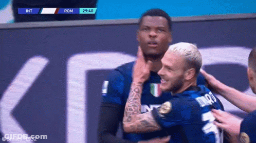 Soccer Players Hugging Number 9 Jersey GIF