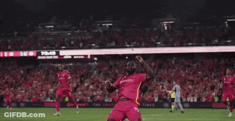 Soccer Players Hugging On Field GIF