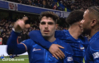 Soccer Players Hugging On Field GIF
