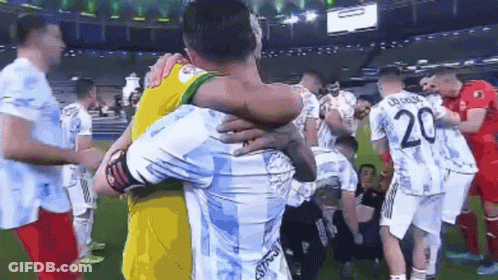 Soccer Players Hugging On Field GIF