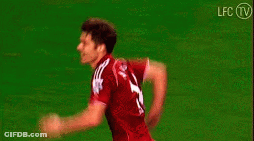 Soccer Players Hugging On Field GIF