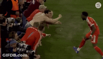 Soccer Players Hugging On Field GIF