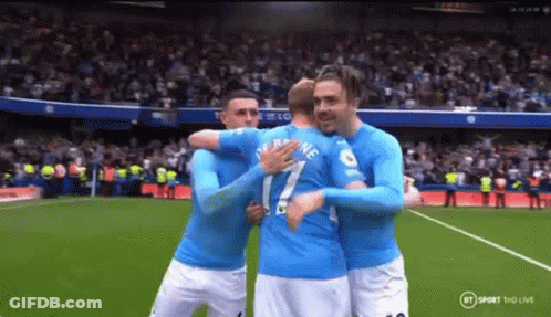 Soccer Players Hugging On Field GIF