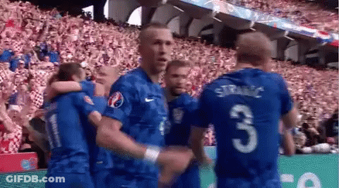 Soccer Players Hugging On Field GIF