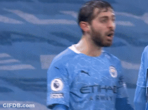 Soccer Players Hugging With Self Sign GIF