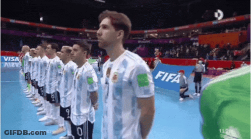 Soccer Players In A Line With FIFA Banner GIF