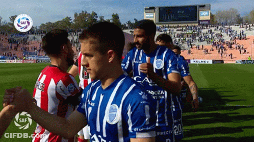 Soccer Players In Blue And White Jerseys Number 20 GIF