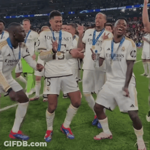 Soccer Players In Emirates Jerseys Celebrate On Field GIF