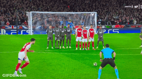 Soccer Players In Front Of Goal Saying PS5 GIF
