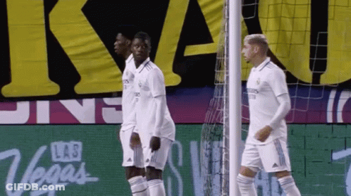 Soccer Players In Front Of Las Vegas Sign GIF