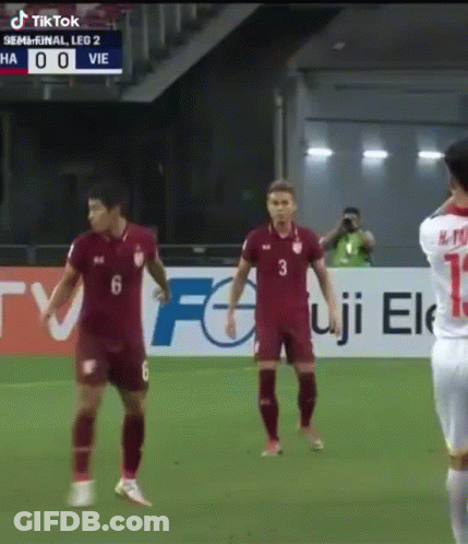 Soccer Players In Front Of TikTok Banner GIF