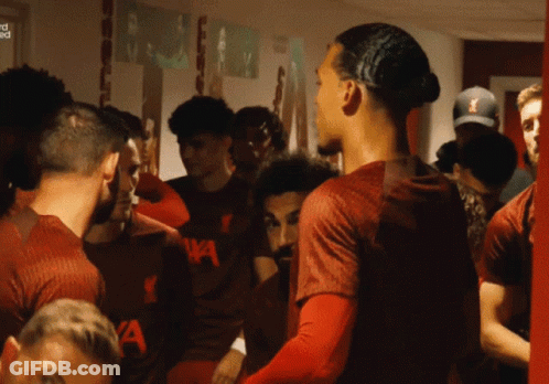 Soccer Players In Locker Room With Shirt Saying A GIF