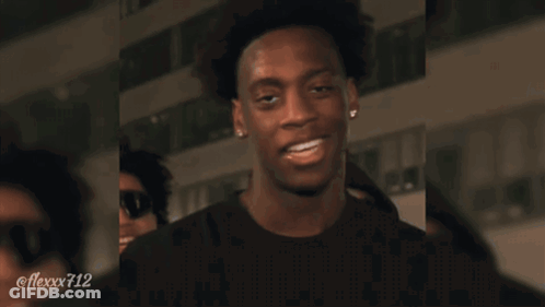 Soccer Players In Orange Vests With Letters U And N GIF