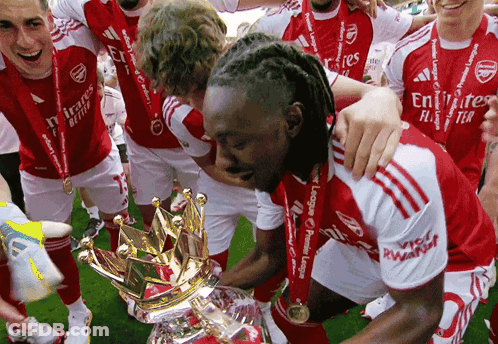 Soccer Players In Red And White Emirates Fly Better Uniforms GIF