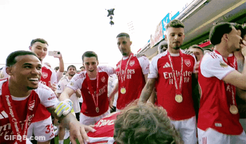 Soccer Players In Red And White Emirates Jerseys GIF