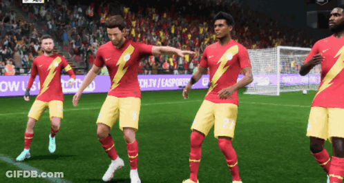 Soccer Players In Red And Yellow With Lightning Bolts GIF